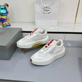 PRADA 25S CROSS LACED SNEAKERS IN WHITE CALFSKIN