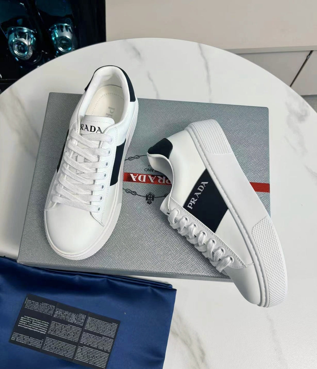 PRADA 25S LEATHER LOGO OUTLET SNEAKERS BLACK AND WHITE CALFSKIN