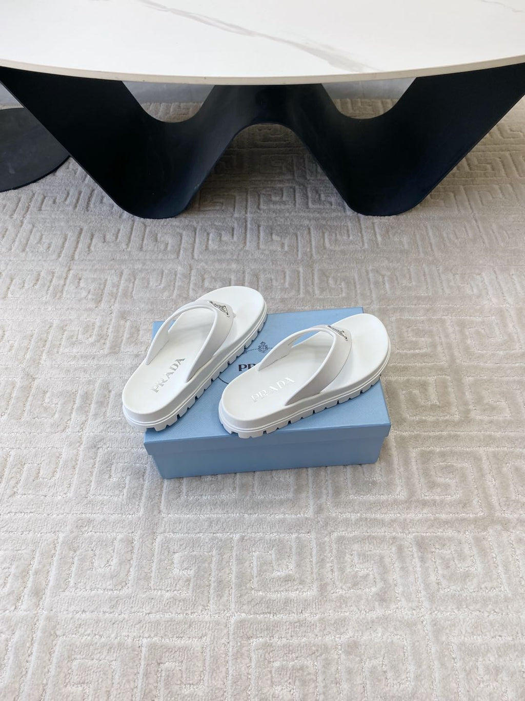 PRADA THICK-SOLED FLIP FLOPS IN WHITE RUBBER