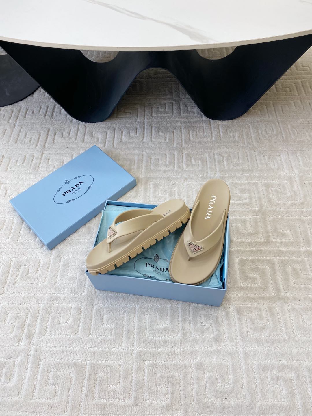 PRADA THICK-SOLED FLIP FLOPS IN ECRU BEIGE RUBBER