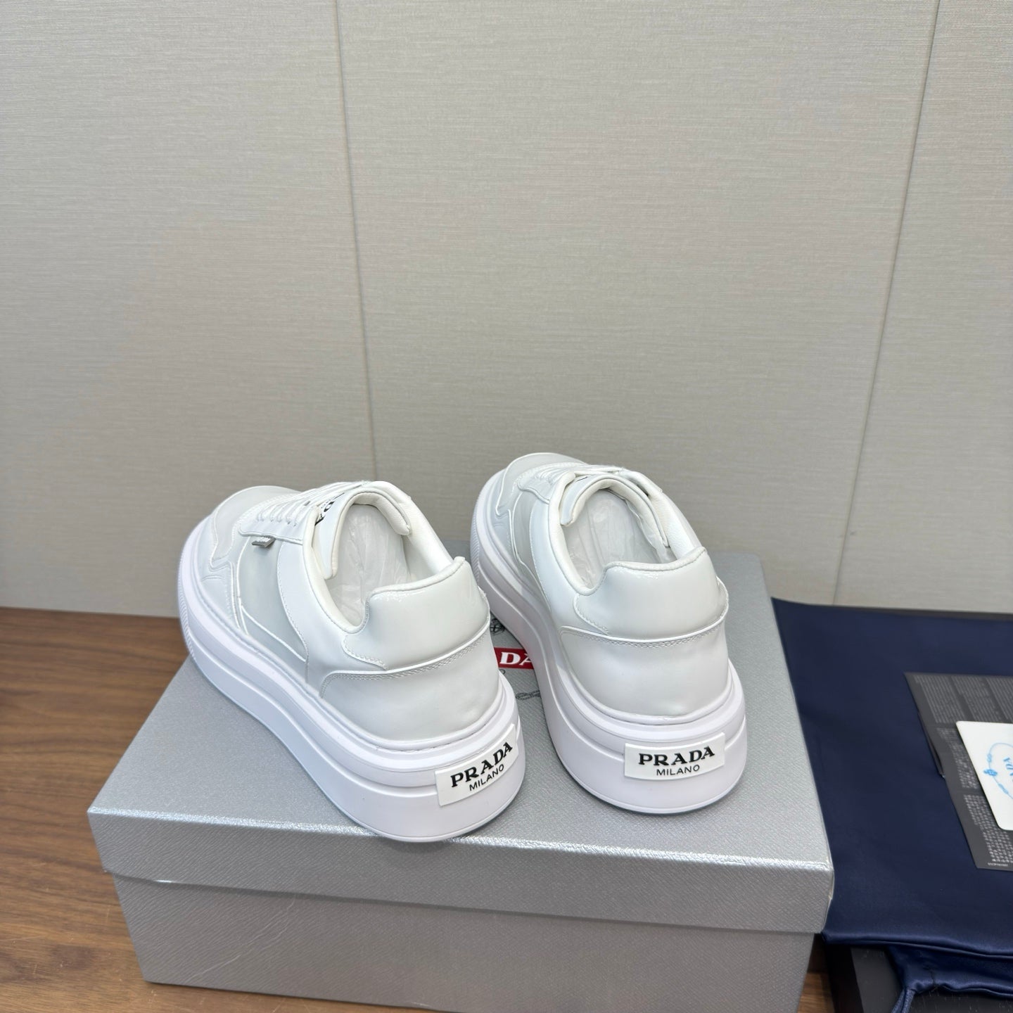 PRADA 25S DOWNTOWN BOLD SNEAKERS 45MM IN WHITE CALFSKIN