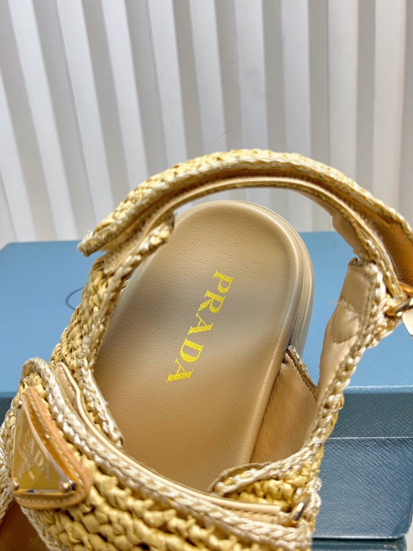 PRADA THICK-SOLED SLIDE IN BEIGE RAFFIA