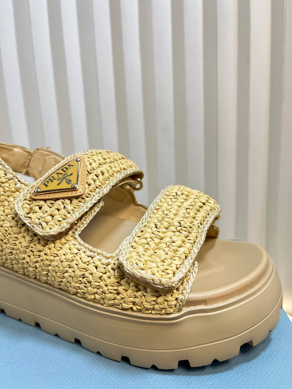 PRADA THICK-SOLED SLIDE IN BEIGE RAFFIA