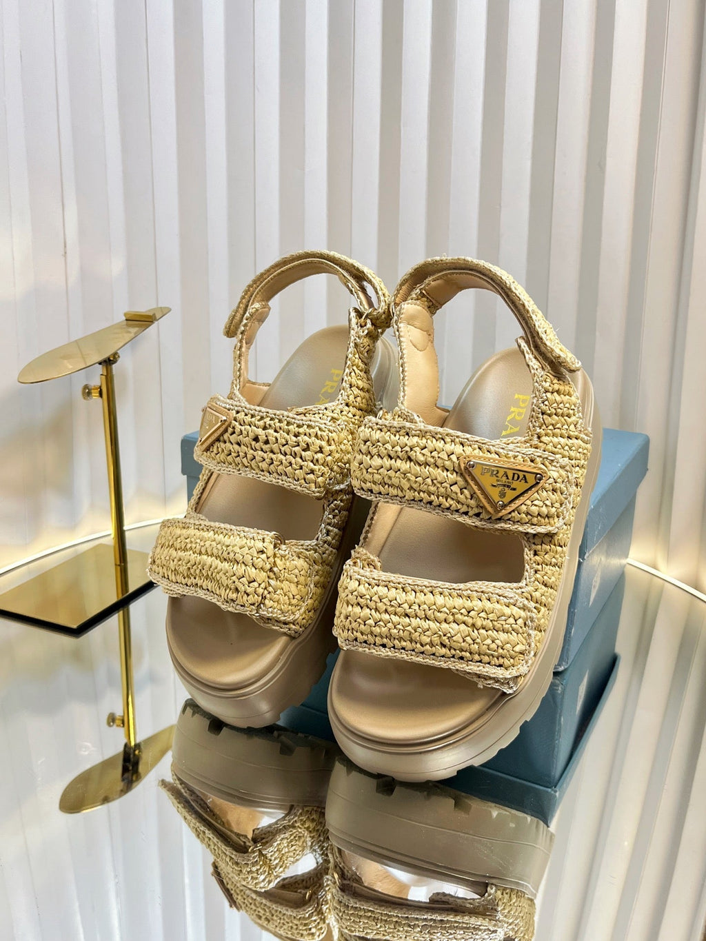 PRADA THICK-SOLED SLIDE IN BEIGE RAFFIA