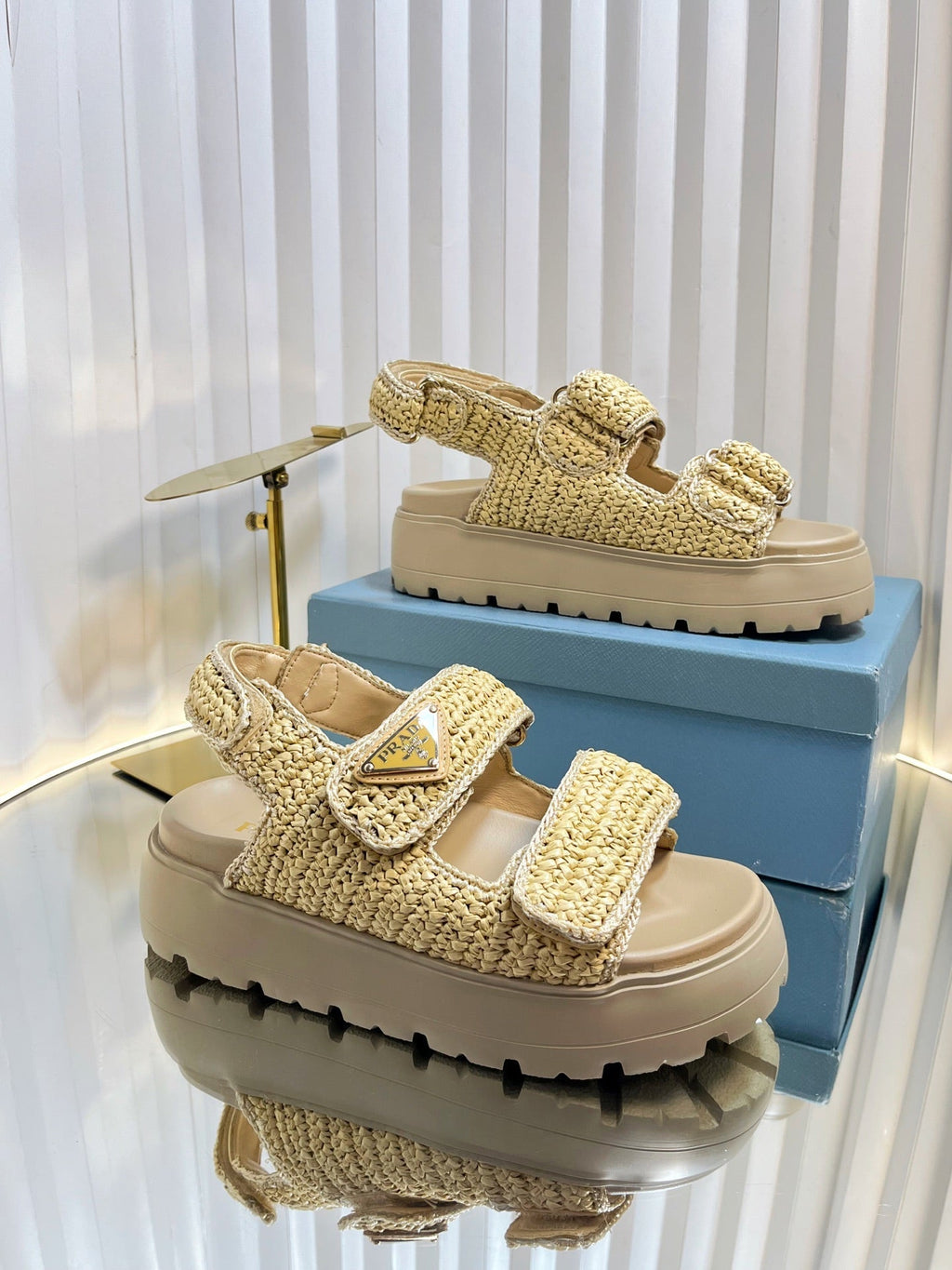PRADA THICK-SOLED SLIDE IN BEIGE RAFFIA
