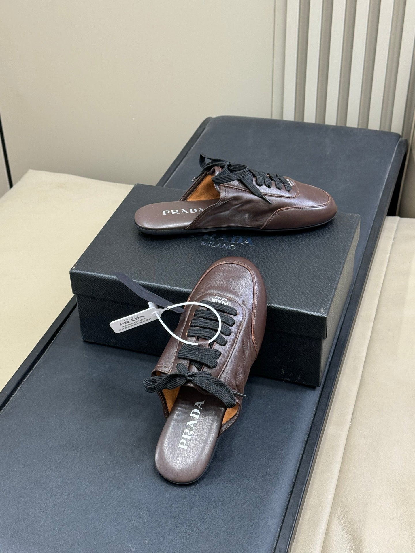 PRADA 25S COLLAPSE MULES IN RK BROWN CALFSKIN