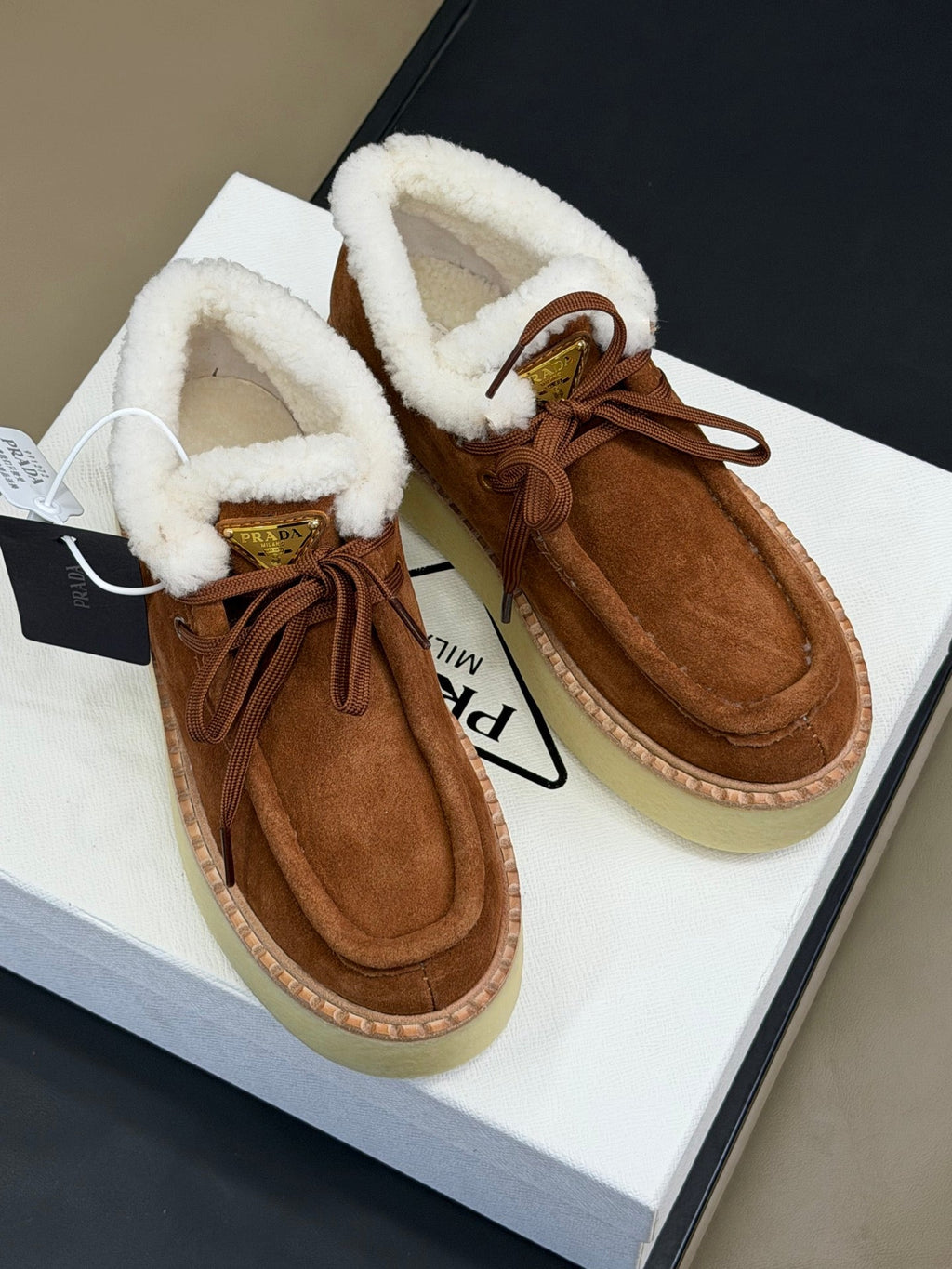PRADA 25S HIGH-TOP SHOES 40 MM IN RK BROWN SUEDE SHEARLING-LINED