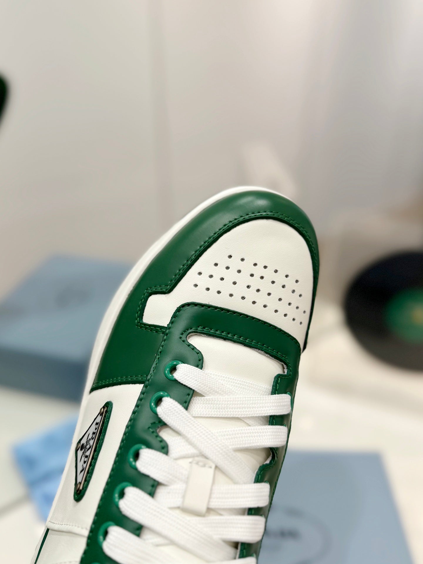 PRADA DOWNTOWN PERFORATED SNEAKERS WHITE AND GREEN CALFSKIN