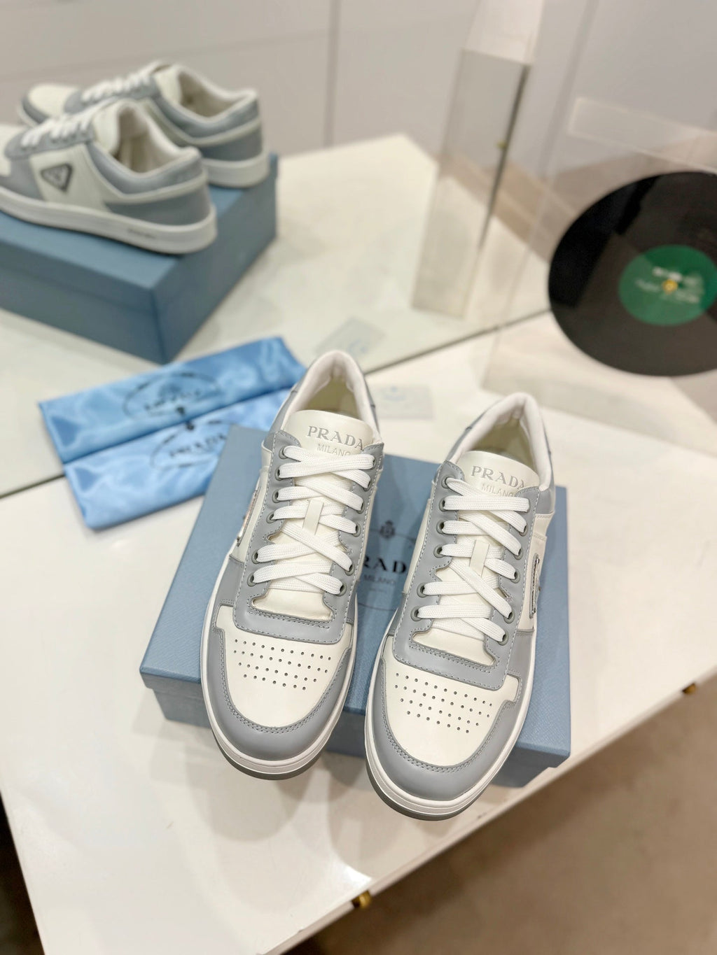 PRADA DOWNTOWN PERFORATED SNEAKERS WHITE AND GRAY CALFSKIN