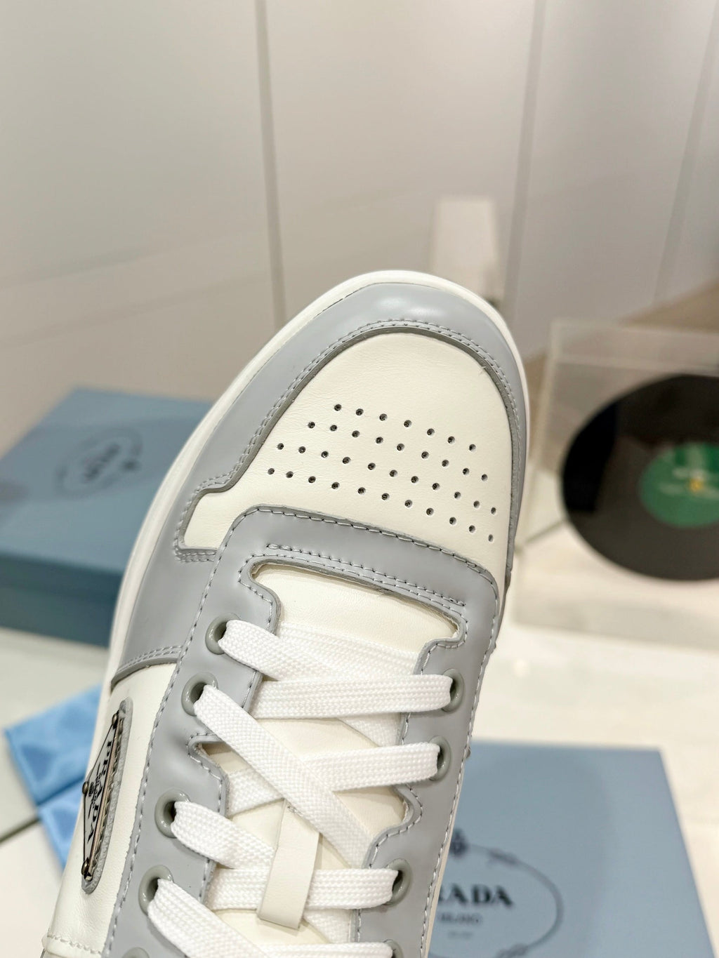 PRADA DOWNTOWN PERFORATED SNEAKERS WHITE AND GRAY CALFSKIN